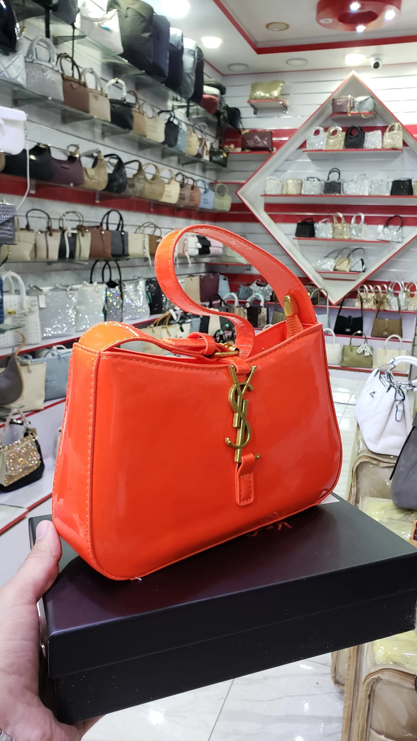 حقيبة YSL برتقالية لامعة
